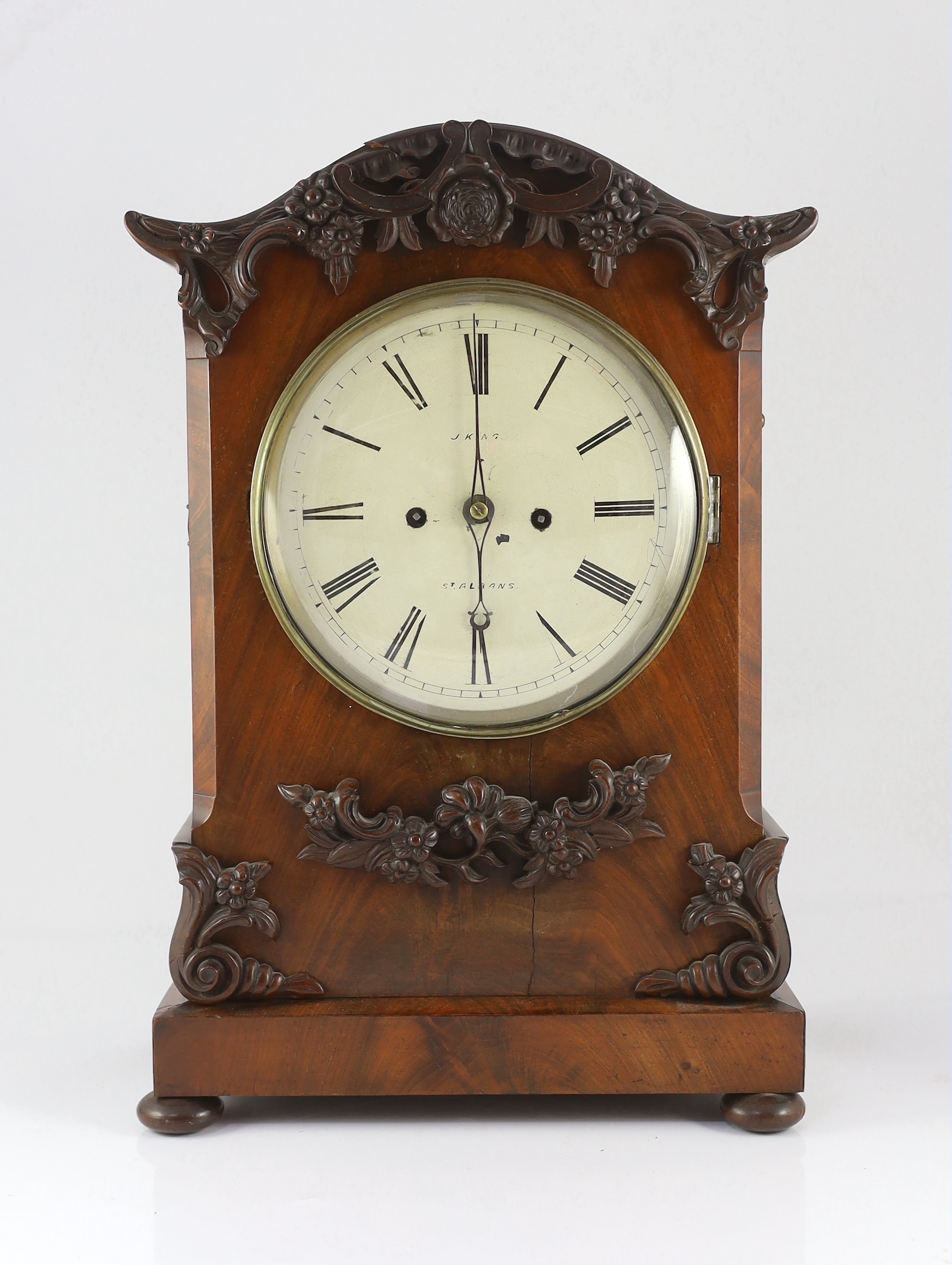 J. King of St Albans. A William IV mahogany bracket clock, in architectural case with flower and scroll appliqué motifs and painted Roman dial, unsigned twin fusee movement with anchor escapement striking on a bell, 33cm